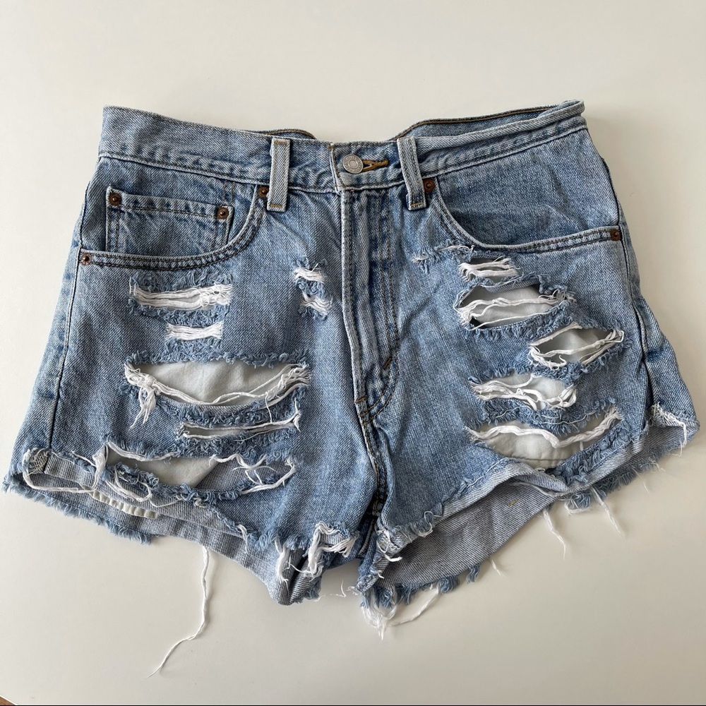 Levi’s 550 distressed ripped denim shorts